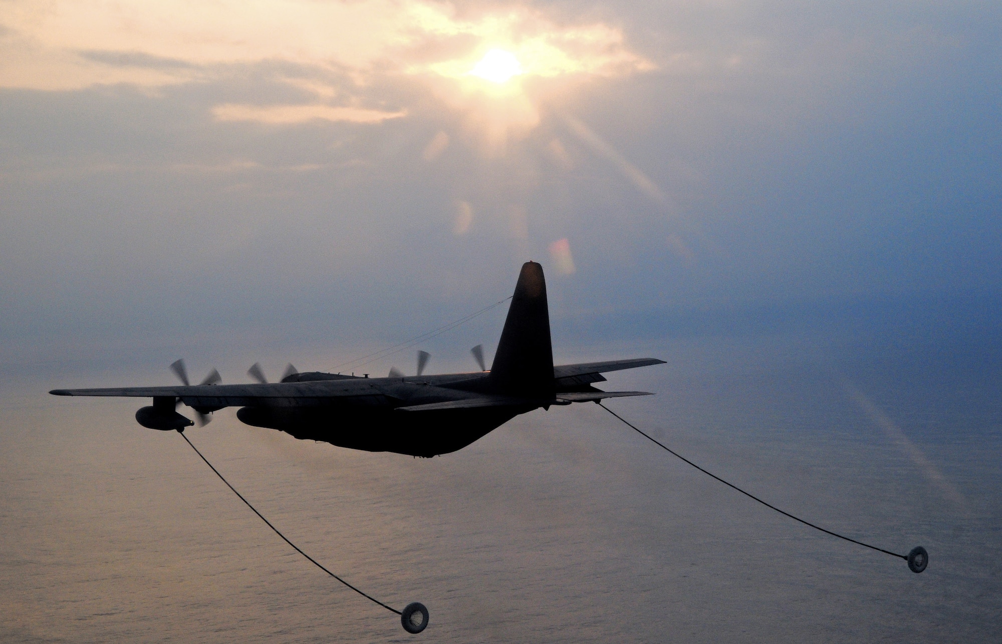 An MC-130 prepares to refuel helicopters during a three-day intensive air refueling course March 24 at Kadena Air Base, Japan. (U.S. Air Force photo/Staff Sgt. Chrissy Best) 
