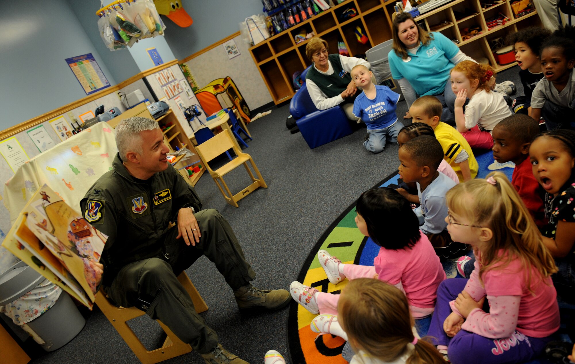 MOODY AIR FORCE BASE, Ga. -- Col. Kenneth Todorov, 23rd Wing commander, reads a book to children at the Child Development Center here April 8. Colonel Todorov signed a proclamation for Month of the Military Child and Child Abuse Prevention Month during his visit to the center. (U.S. Air Force photo by Senior Airman Gina Chiaverotti)