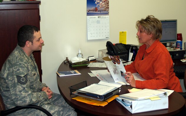 Renae Hutchins discusses TriCare benefits and options with a customer. Mrs. Hutchins was named the Health Benefits Advisor of the Year for the Air Force. (Courtesy photo)   