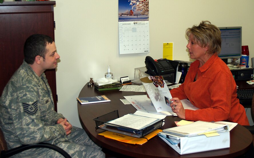 Renae Hutchins discusses TriCare benefits and options with a customer. Mrs. Hutchins was named the Health Benefits Advisor of the Year for the Air Force. (Courtesy photo)   