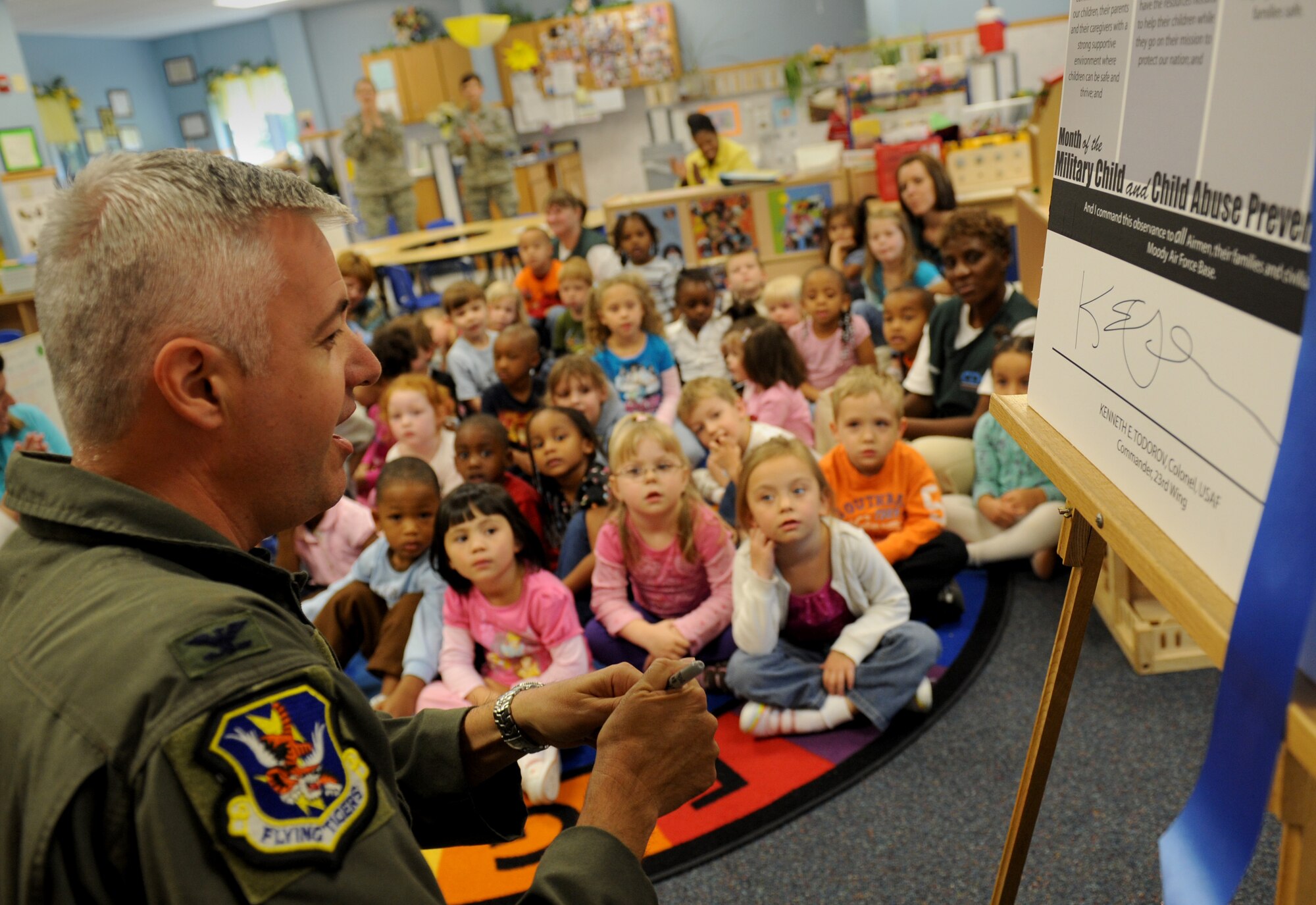 MOODY AIR FORCE BASE, Ga. -- Col. Kenneth Todorov, 23rd Wing commander, signs a proclamation for Month of the Military Child and Child Abuse Prevention Month at the Child Development Center here April 8. (U.S. Air Force photo by Senior Airman Gina Chiaverotti)