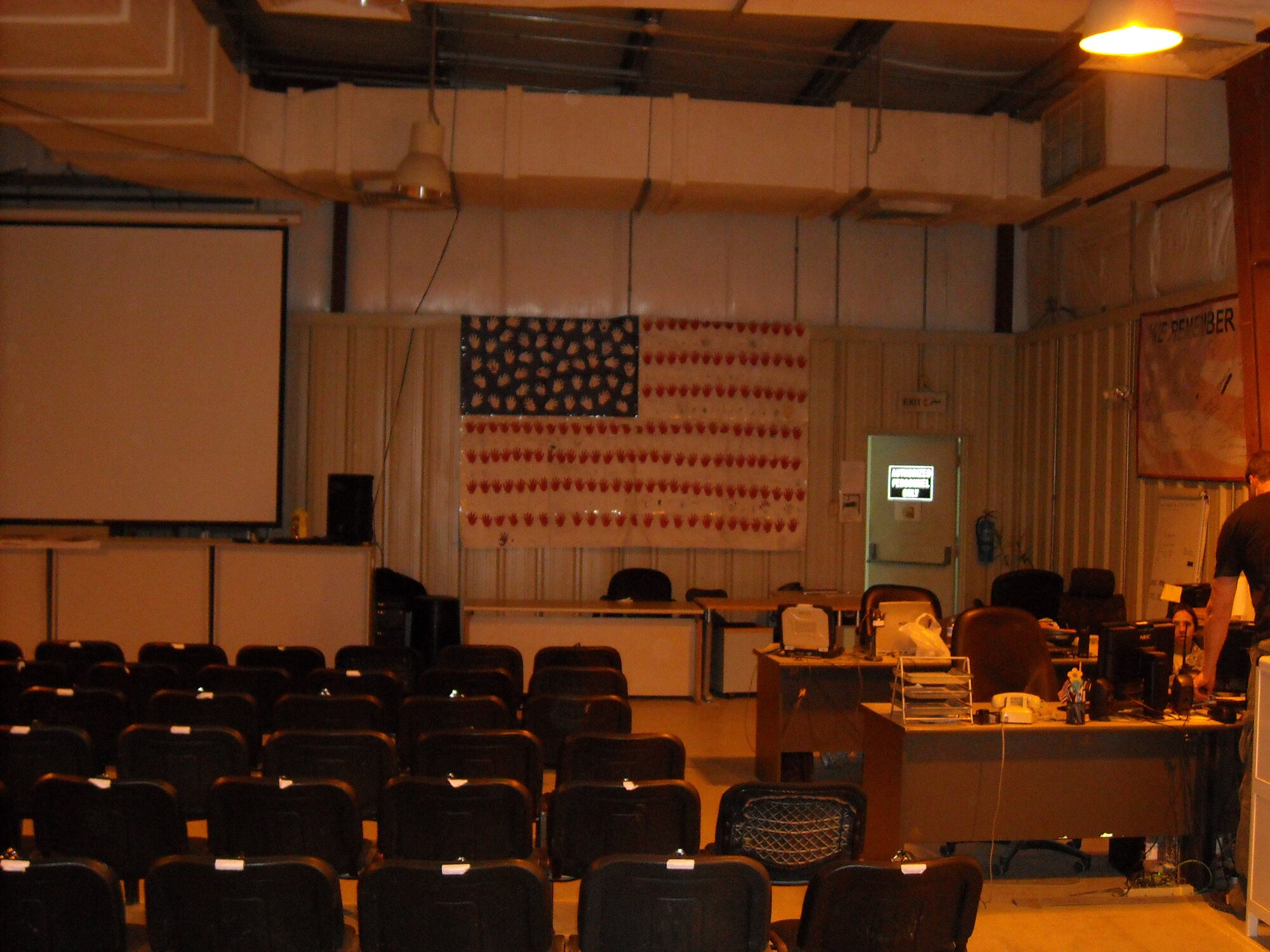 MCCONNELL AIR FORCE BASE, Kan. -- Andover Elementary School children recently created a flag honoring deployed servicemembers. Each stripe and star is a hand print from a child at the school and contains either a message from the child or just their name.  The flag hangs  in the processing center at Al Udeid Air Base, Qatar.  Anybody moving in or out of the Area of Responsibility will see it as they receive their in/out processing briefs.  (courtesy photo)