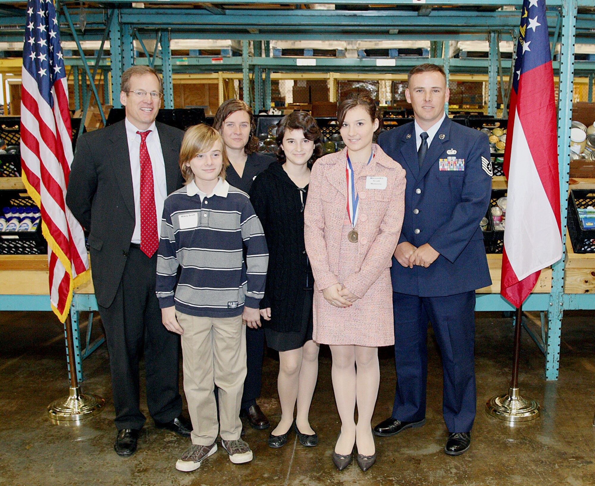 MOODY AIR FORCE BASE, Ga. -- Alexandra Scott, 16-year-old daughter of Tech. Sgt. Michael Scott, recently received the Bronze Congressional Award presented by Congressman Jack Kingston in Valdosta, Ga., March 30. Alexandra logged many volunteer and community service hours that qualified her to compete for the award. (Courtesy photo)