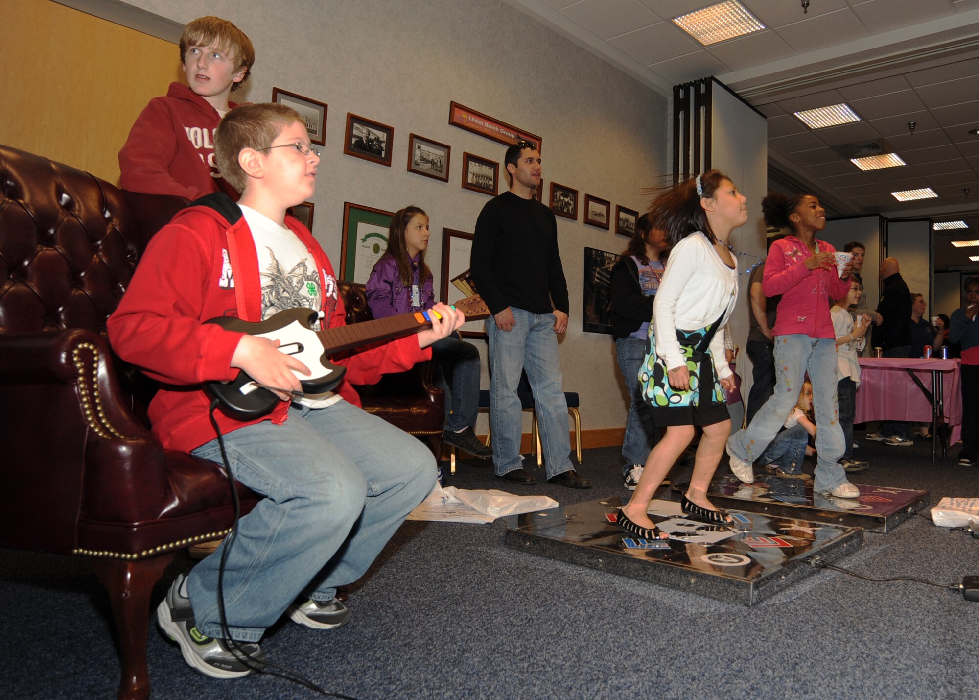 MCCONNELL AIR FORCE BASE, Kan. -- Team McConnell children play Guitar Hero and Dance Dance Revolution on video game consoles and other games during the Family Festival of Fun, April 4. This is the festival’s 11th year of celebration and gives a chance for military families to enjoy some down time with their children during “Month of the Military Child.” (Photo by Airman 1st Class Maria Ruiz)