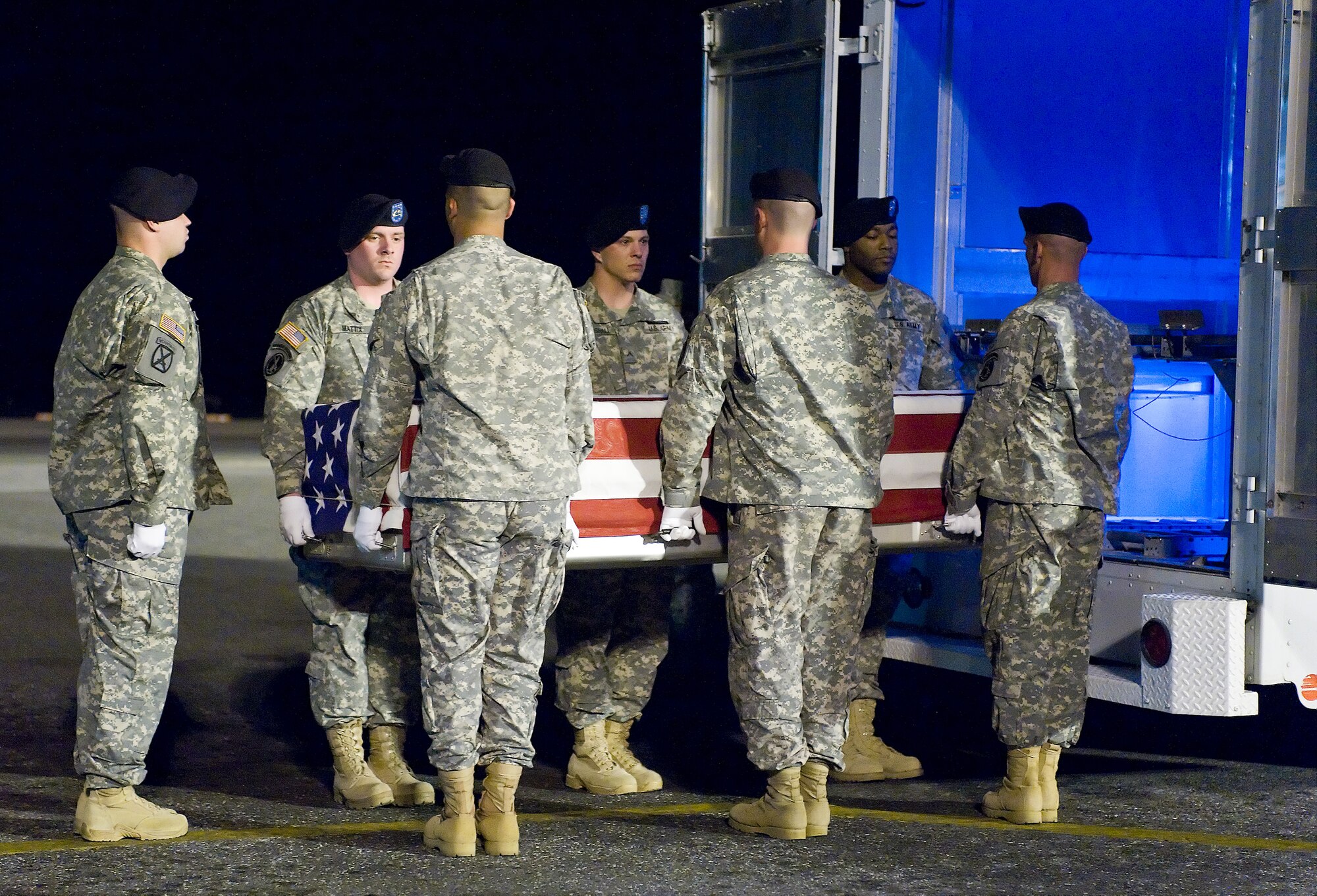 An Army carry team transfers the remains of Army Spc. Israel Candelaria Mejias, of San Lorenzo, Puerto Rico, at Dover Air Force Base, Del., April 7. Specialist Candelaria Mejias died April 5 near Baghdad, Iraq, of wounds sustained when a mine detonated near him during combat operations. He was assigned to the 1st Battalion, 2nd Infantry Regiment in Task Force 3rd Battalion, 66th Armor Regiment, 172nd Brigade Combat Team, Grafenwoehr, Germany. (U.S. Air Force photo/Roland Balik)