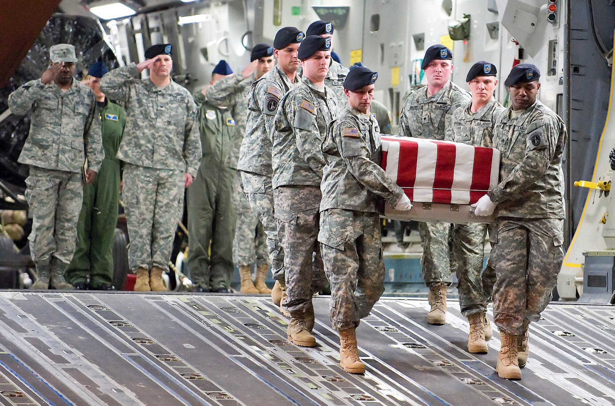 An Army carry team transfers the remains of Army Spc. Israel Candelaria Mejias, of San Lorenzo, Puerto Rico, at Dover Air Force Base, Del., April 7. Specialist Candelaria Mejias died April 5 near Baghdad, Iraq, of wounds sustained when a mine detonated near him during combat operations. He was assigned to the 1st Battalion, 2nd Infantry Regiment in Task Force 3rd Battalion, 66th Armor Regiment, 172nd Brigade Combat Team, Grafenwoehr, Germany. (U.S. Air Force photo/Roland Balik)
