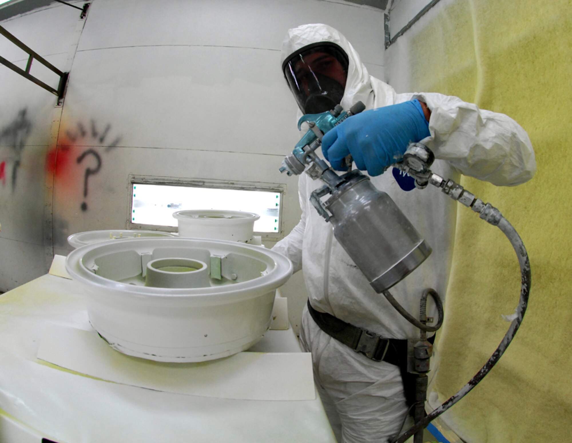 Staff Sgt. Martin Roberts, 9th Maintenance Squadron NCO in charge of corrosion control, touches up a set of wheels for the U-2 Dragon Lady April 8 at the fabrication shop. Sergeant Roberts performs corrosion control duties to keep the U-2 running smoothly. (Photo by Airman 1st Class David Tracy)