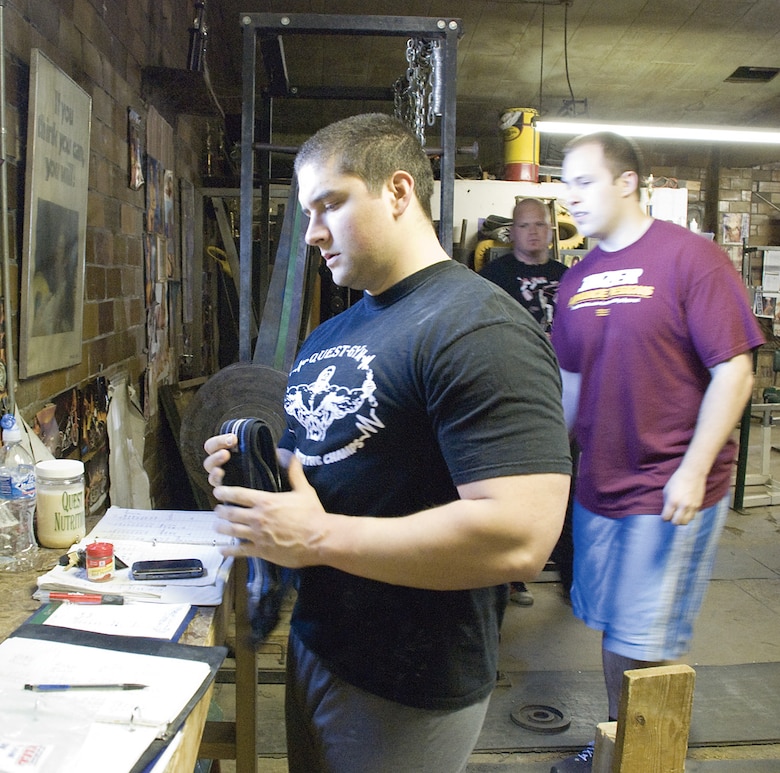 SCOTT AIR FORCE BASE, Ill. --Brady Stewart (left) talks with fellow weightlifter Scott Baquet Friday at the Belleville Weightlifting Club.(U.S. Air Force photo/Steve Berry) 
