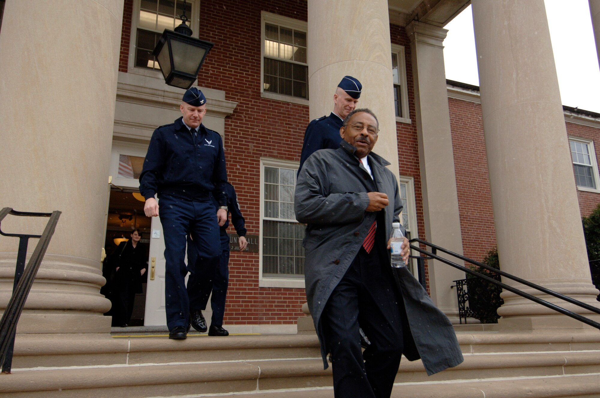 SCOTT AIR FORCE BASE, Ill. --U.S. Senator Roland Burris exits the 375th Airlift Wing headquarters building after a briefing from wing commander Col. Gary Goldstone Monday. Brig. Gen. Taco Gilbert from Air Mobility Command then escorted the senator for briefings with U.S. Transportation Command and AMC officials. Scott was the first stop on the senators three day tour of Southern Illinois.(U.S. Air Force photo/Karen Petitt)