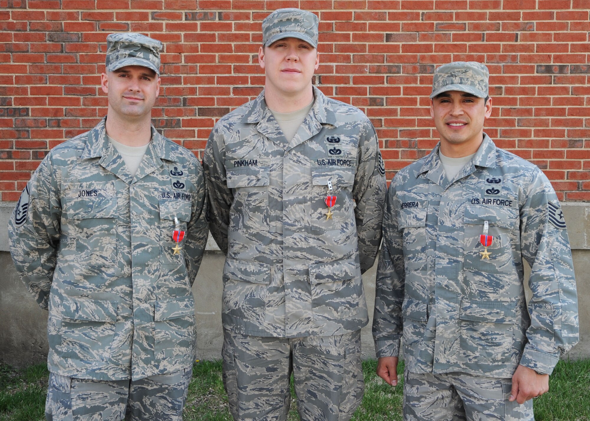 SCOTT AIR FORCE BASE, Ill. --Master Sgt.  Neil Jones, Tech. Sgt. David Pinkham and Tech. Sgt. Manuel Herrera, 375th Civil Engineer explosive ordnance technicians, recently received the Bronze Star Medal for heroism and bravery during their recent deployments.(U.S. Air Force photo/Airman 1st Class Wesley Farnsworth)  