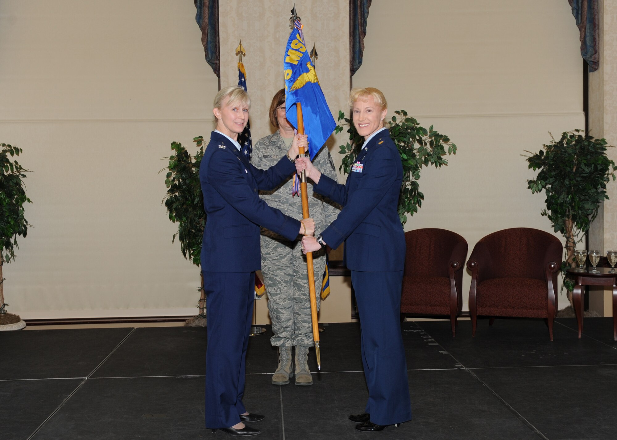 SCOTT AIR FORCE BASE. Ill. -- Col. Melissa Applegate, 375th Mission Support Group commander, hands over the 375th Force Support Squadron guidon to Maj. Billeye Juarez, 375th Force Support Squadron commander, during the 375th FSS activation ceremony at the Scott Club April 3. (U.S. Air Force photo/Staff Sgt. Paul Villanueva II) 