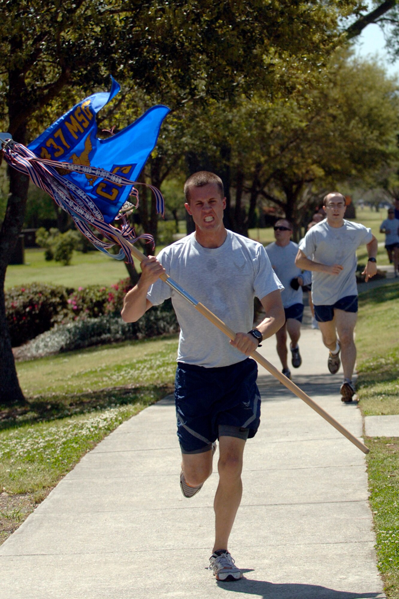 second Lieutenant Eric Hansen is the first guidon to finish the 5k Commander's Fitness Challenge on Charleston AFB April 3.  More than 300 Airmen from around the base came out to participate in the monthly challenge. Lieutenant Hansen is with the 437th Civil Engineering Squadron. (U.S. Air Force photo/Senior Airman Timothy Taylor)
