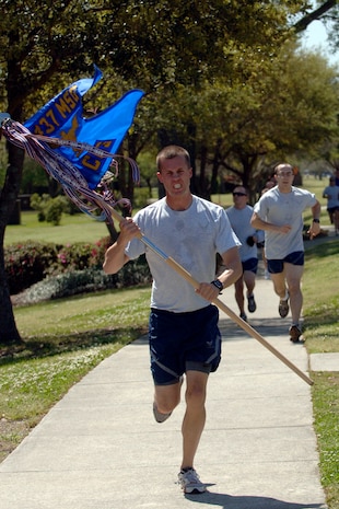 second Lieutenant Eric Hansen is the first guidon to finish the 5k Commander's Fitness Challenge on Charleston AFB April 3.  More than 300 Airmen from around the base came out to participate in the monthly challenge. Lieutenant Hansen is with the 437th Civil Engineering Squadron. (U.S. Air Force photo/Senior Airman Timothy Taylor)
