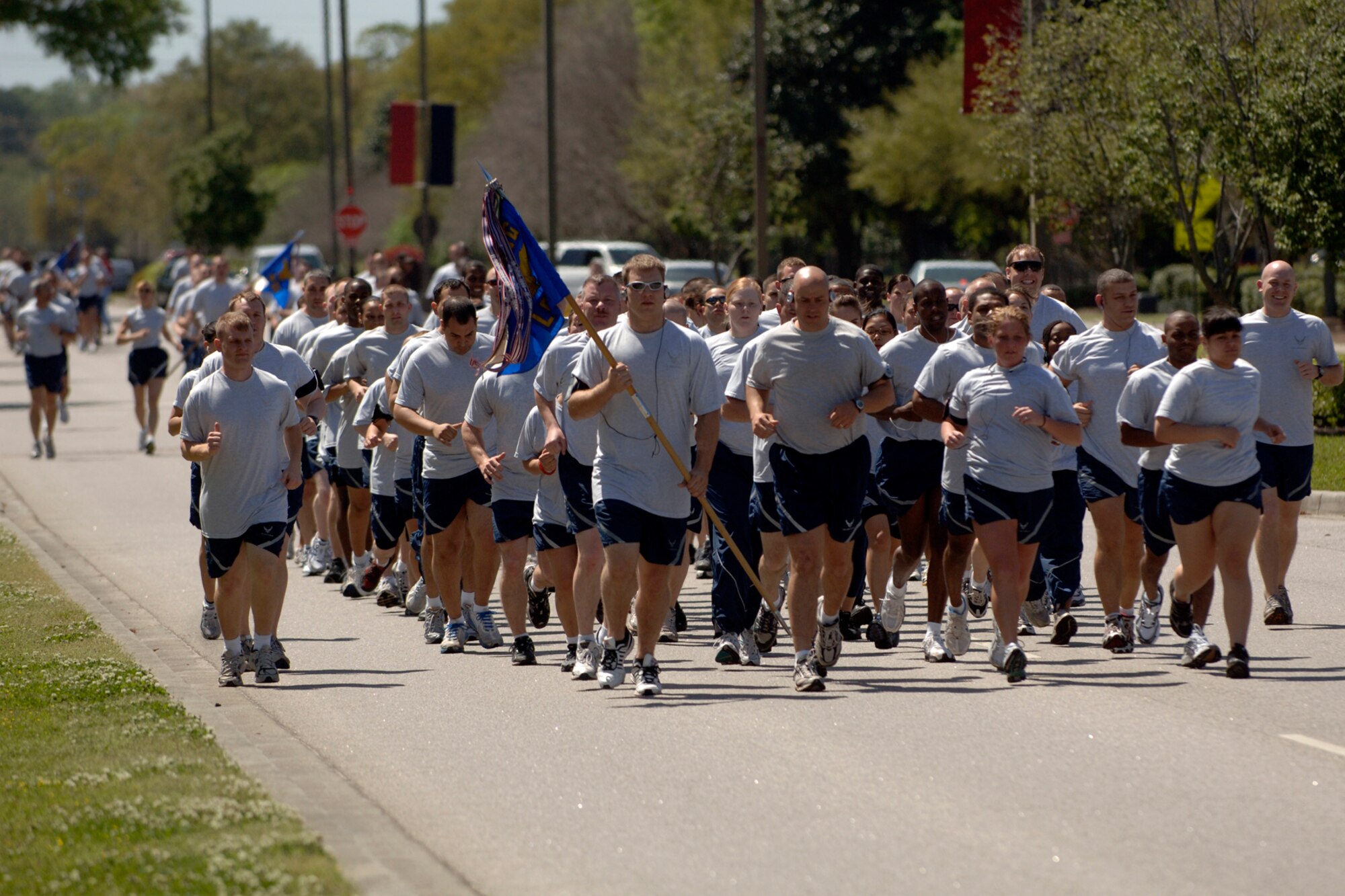 Team Charleston Airmen start the 5k Commander's Fitness Challenge from the fitness center in formation on Charleston AFB April 3. More than 300 Airmen from around the base came out to participate in the monthly challenge. (U.S. Air Force photo/Senior Airman Timothy Taylor) 
