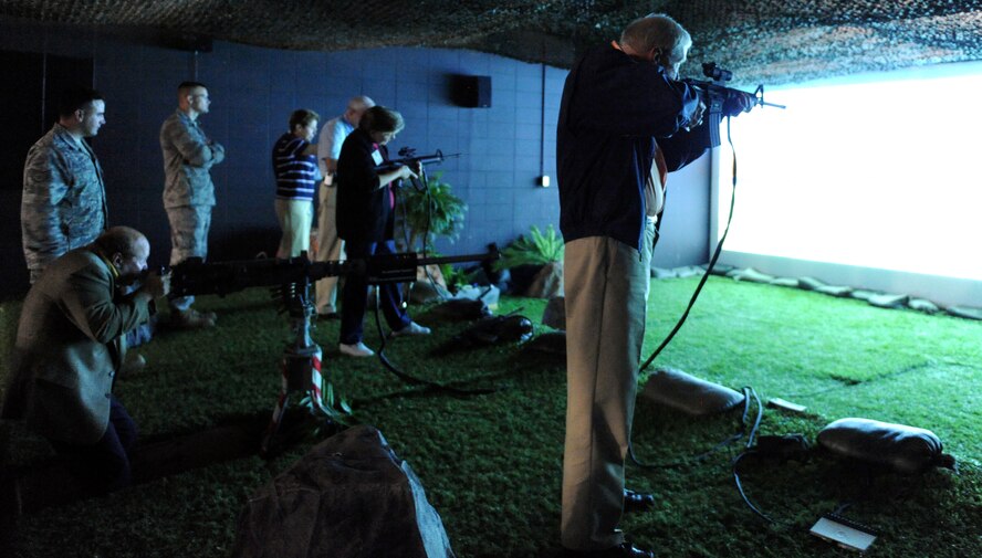 MOODY AIR FORCE BASE, Ga. -- Members of the Georgia Military Affairs Coordinating Committee fire simulated M-16 rifles during a base tour here April 6. The tour allowed GMACC members to see both Moody’s mission and its capabilities. (U.S. Air Force photo by Airman Joshua Green) 