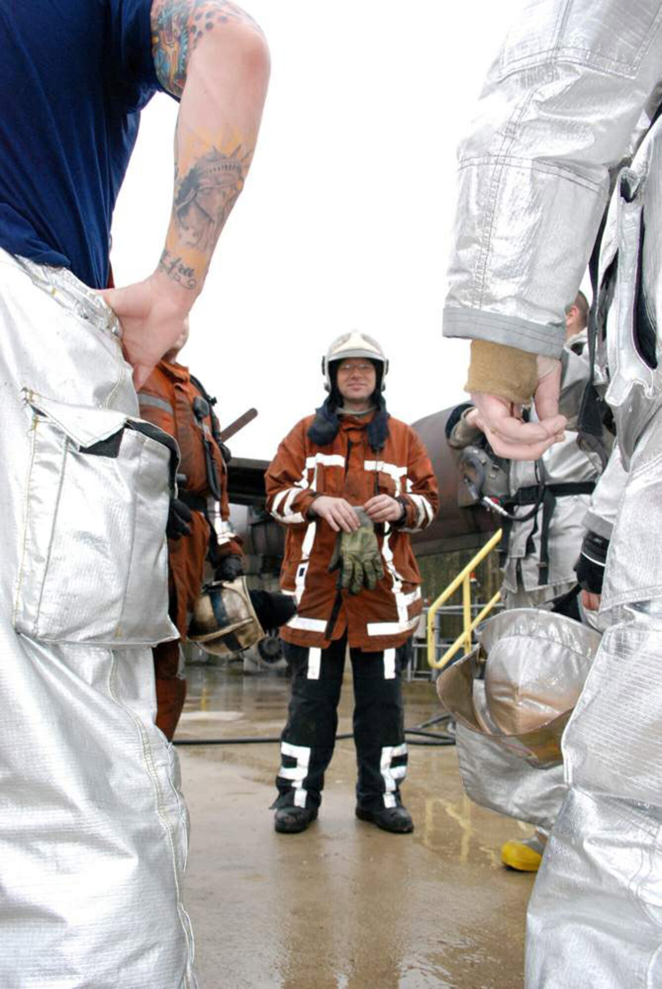 Dutch Sgt. Maj. Henri Meiringh gives firefighters from the 309th Airlift Squadron feedback at the Woensdrecht Firefighting Training Facility. The members of the 309th Airlift Squadron are from Chievres Air Base, Belgium. Sergeant Major Meiringh is a facilitator at the simulator. (U.S. Air Force photo) 
