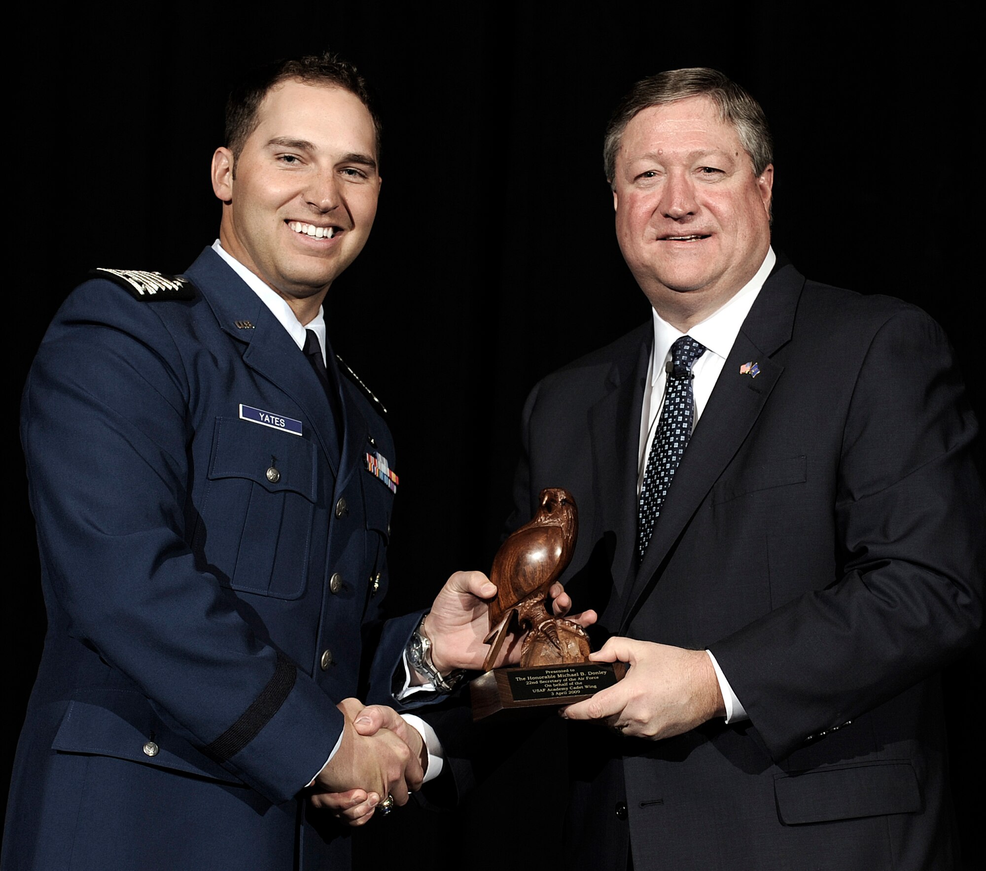 Secretary of the Air Force Michael B. Donley accepts "The Bird" from cadet wing commander Cadet 1st Class Johathan Yates during a cadet call held at Arnold Hall April 3 at the Academy in Colorado. (U.S. Air Force photo/Mike Kaplan)
