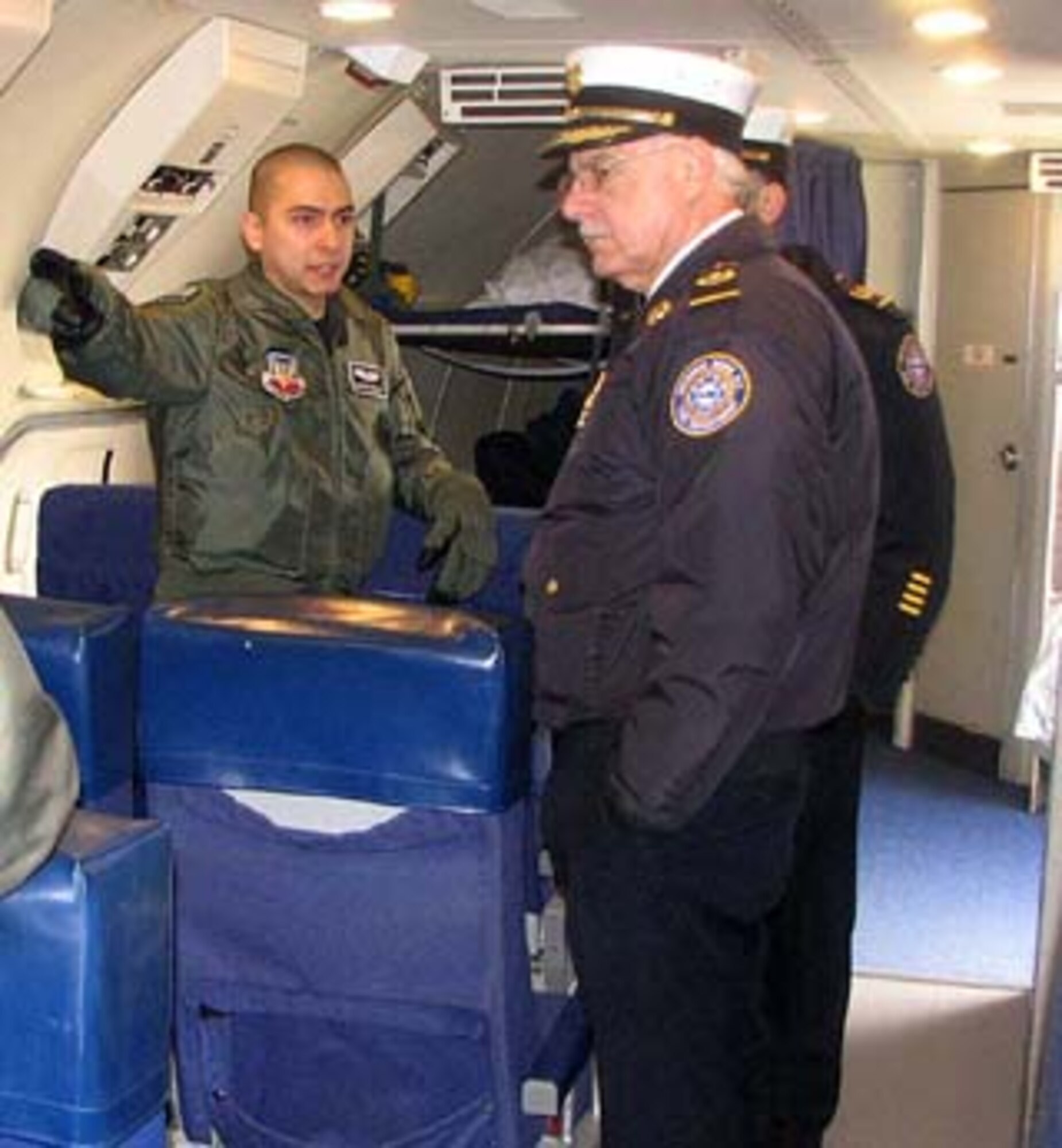 An aircrew member on the E-3 Sentry Airborne Warning and Control System, or AWACS, aircraft from the 552nd Air Control Wing based at Tinker Air Force Base, Okla., briefs Rome Fire Department Chief Roger Sabia about the AWACS mission Tuesday, March 11, 2008. Photo by Brooke Davis, NEADS Public Affairs
