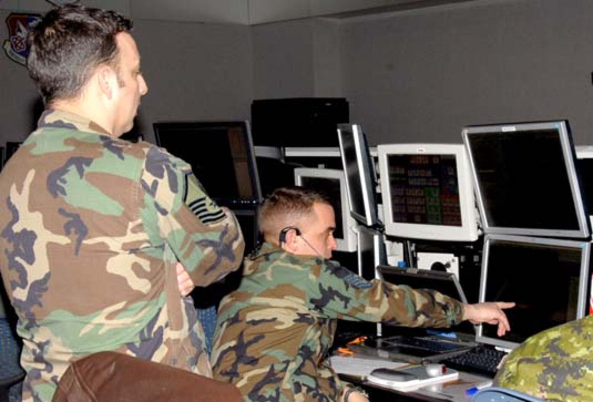 Members from the Northeast Air Defense Sector perform their command and control mission in order to prevent air attacks against the U.S. by responding to unknown, unwanted and unauthorized air activity approaching and operating within U.S. sovereign airspace. Photo by: 174th Fighter Wing Visual Information 
