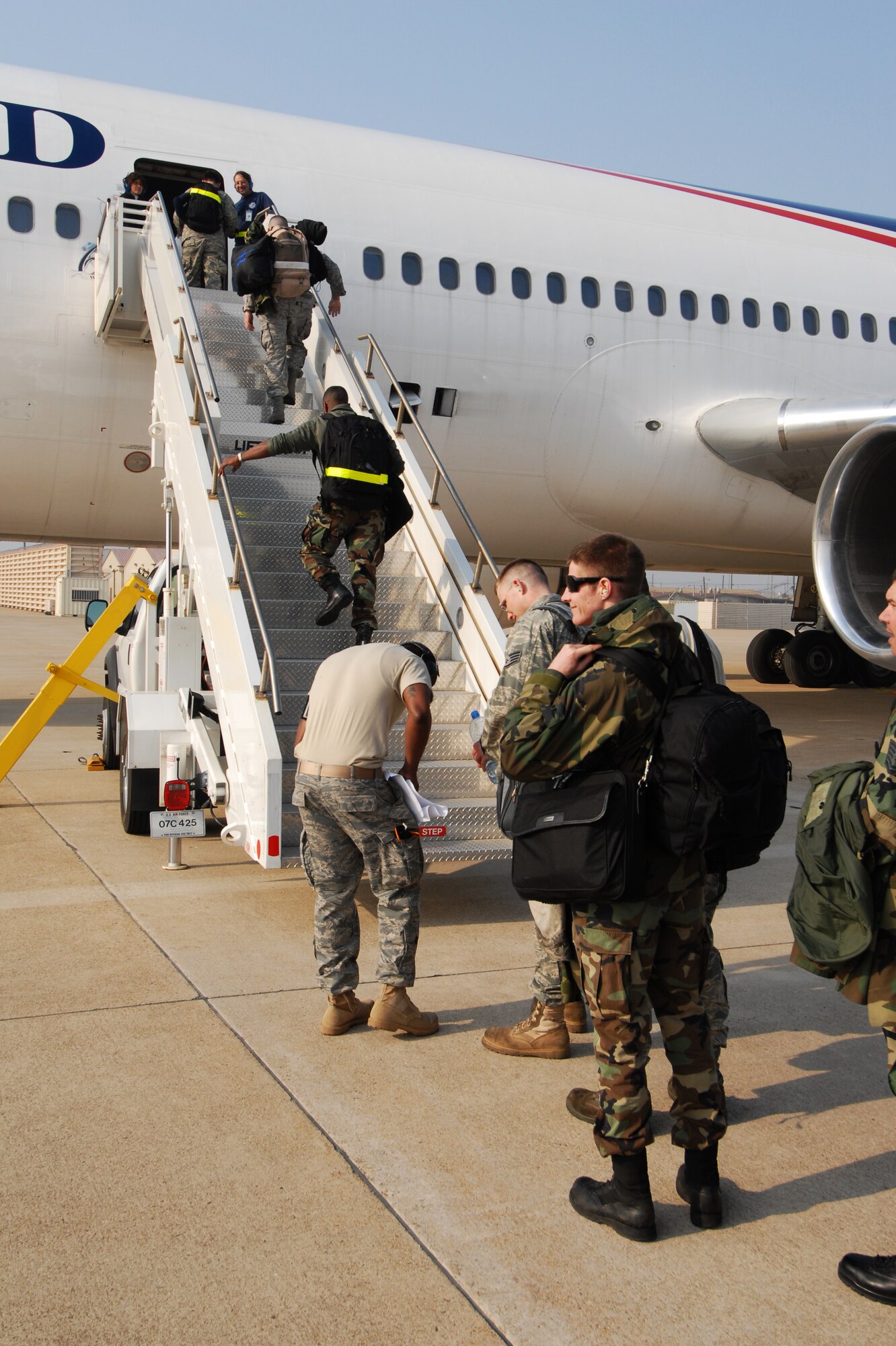 Wolf Pack maintainers assigned to the 8th Aircraft Maintanence Squadron load onto an aircraft to deploy to Eielson Air Force Base, Alaska for Red Flag-Alaska April 7. Red Flag-Alaska is a realistic, 10-day air-combat training exercise. (U.S. Air Force Photo/Senior Airman Gustavo Gonzalez)