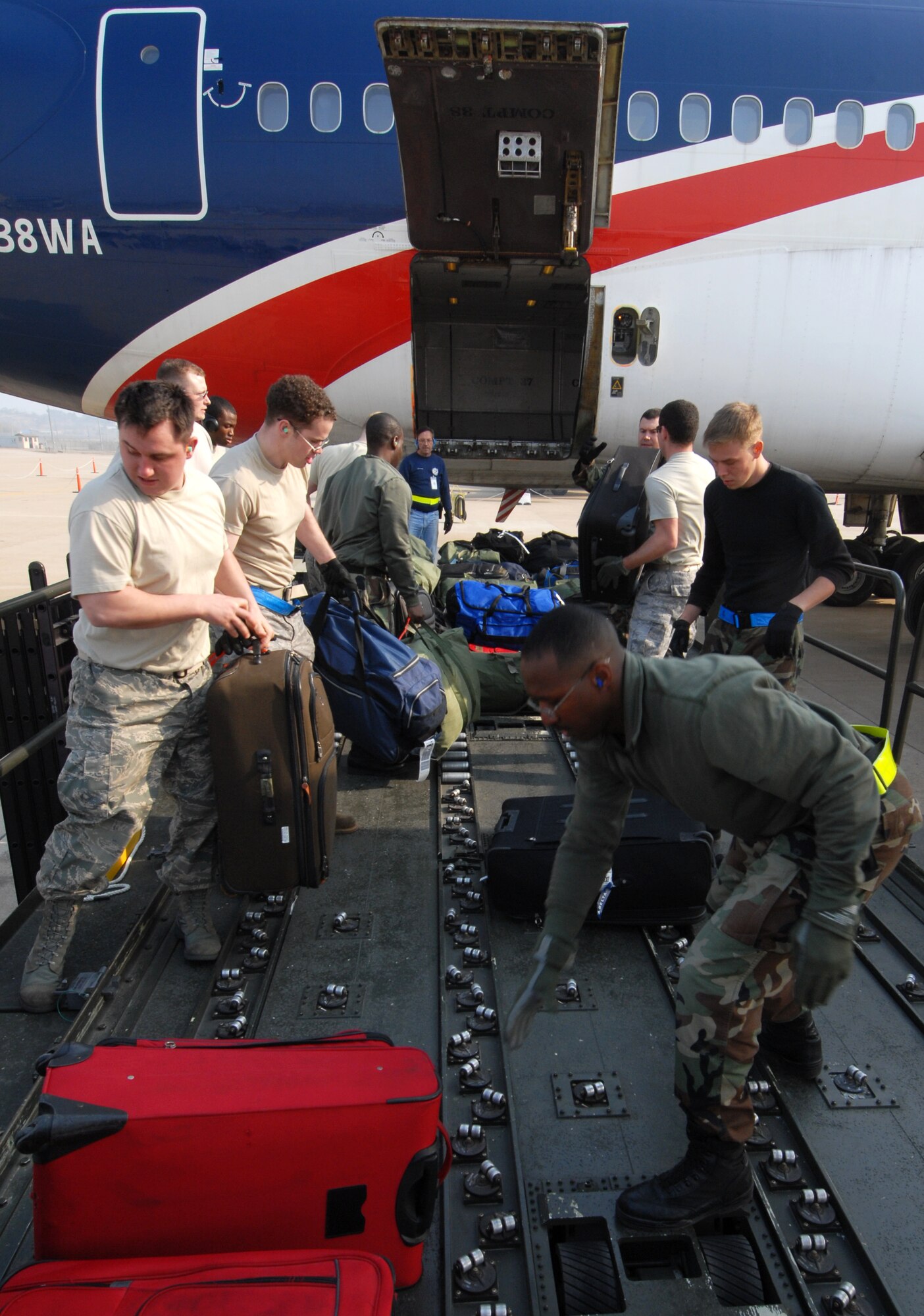 Wolf Pack maintainers assigned to the 8th Aircraft Maintenence Squadron load baggage before deploying Kunsan Air Base, Republic of Korea to Eielson Air Force Base, Alaska for Red Flag-Alaska, April 7. Red Flag-Alaska is a realistic, 10-day air-combat training exercise. (U.S. Air Force Photo/Senior Airman Gustavo Gonzalez)