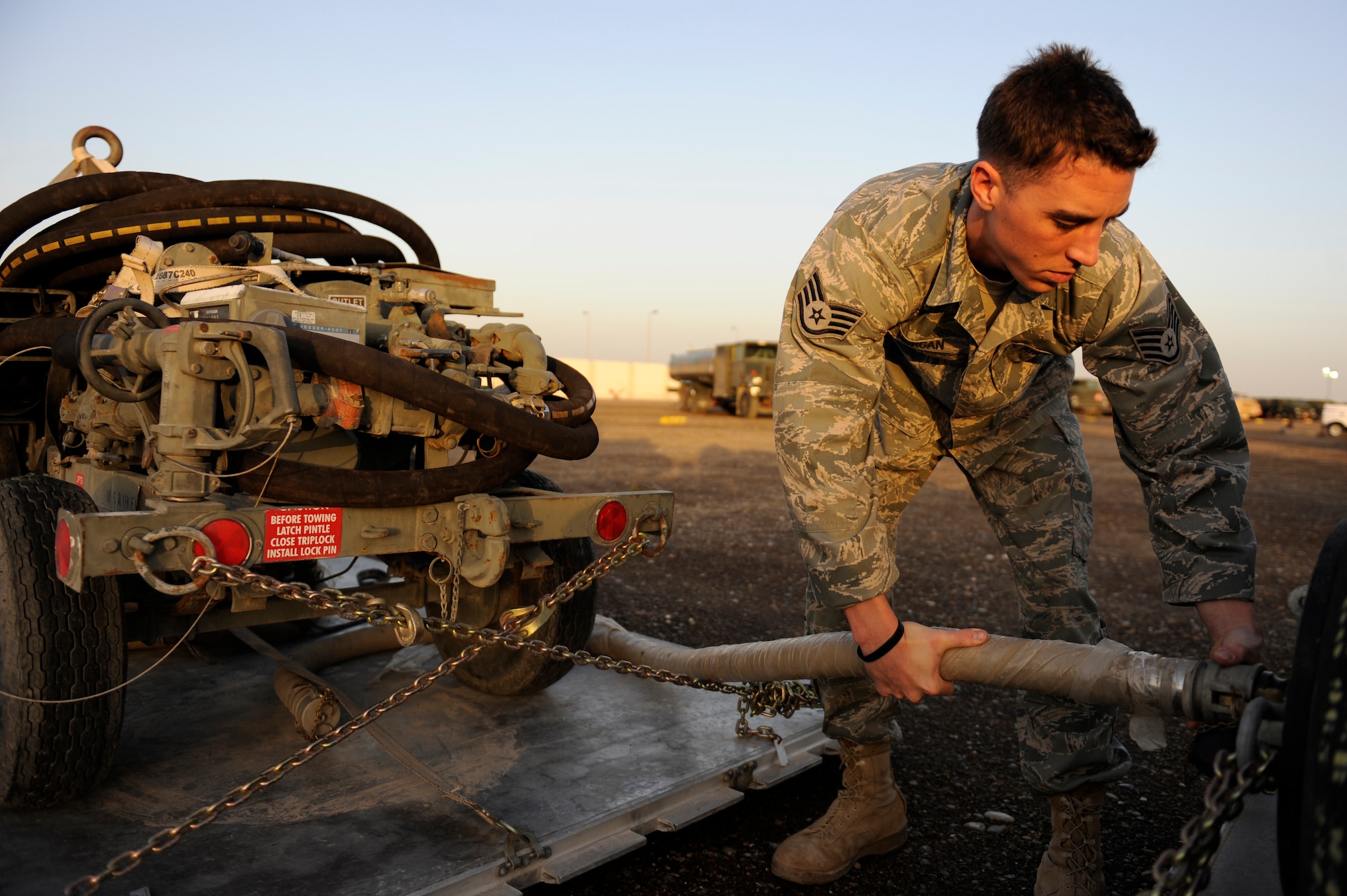 SOUTHWEST ASIA - Staff Sgt. Jason Morgan, 380th Expeditionary Logistics Readiness Squadron, fuels flight, connects a PMU-27 pump to a 500 gallon drum, April 4. The 500 gallon drum will be filled with thermally stable jet fuel. Sergeant Morgan and the fuel will be airlifted to an undisclosed location in Southwest Asia to facilitate the refueling of two U-2 Dragonlady's that were diverted because of poor weather conditions. Sergeant Morgan is deployed from Nellis AFB, Nev. and hails from Buffalo, N.Y. (U.S. Air Force photo by Senior Airman Brian J. Ellis) (Released)