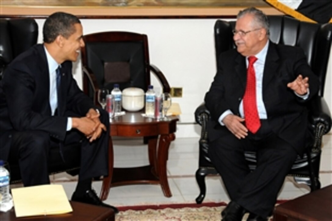 U.S. President Barack Obama and Iraq President Jalal Talabani discuss the success of the U.S.-Iraq security agreement and the growing diplomatic ties between the two countries during a visit to Camp Victory, Iraq, April 7, 2009.