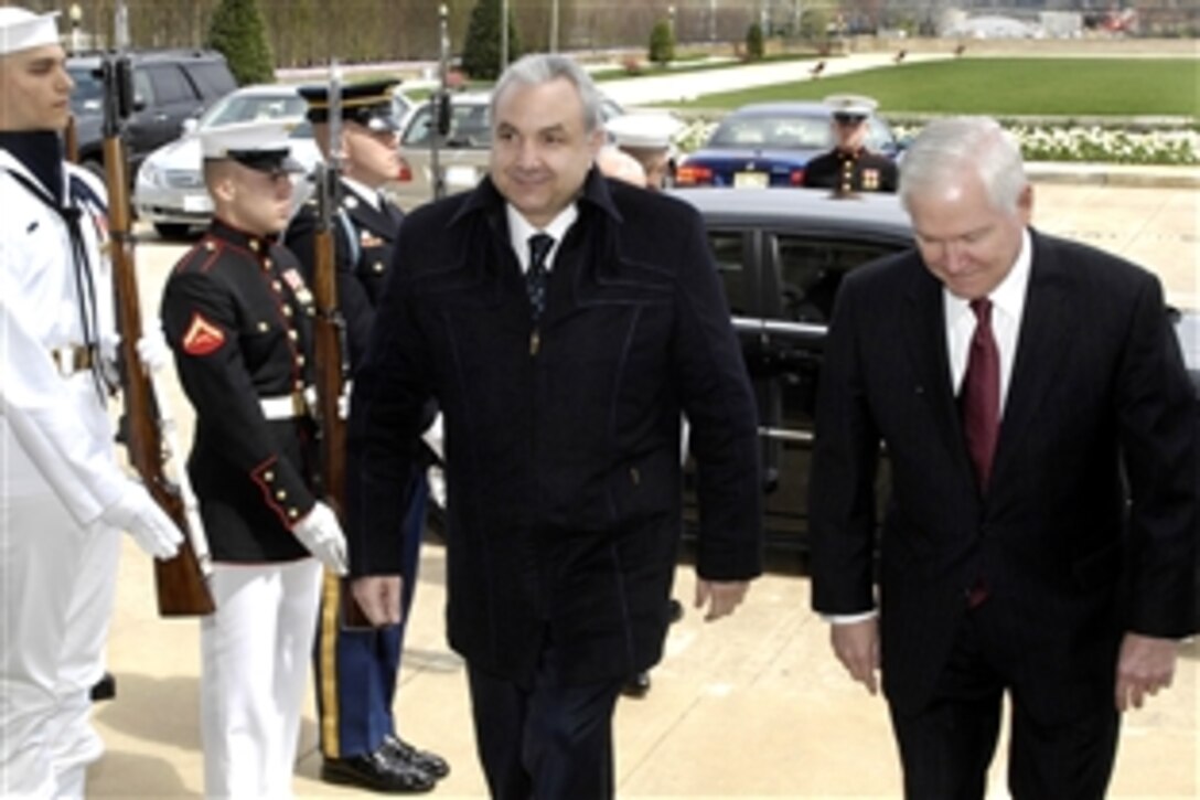 Defense Secretary Robert M. Gates, right, escorts Lebanese Minister of Defense Elias Murr through an honor cordon into the Pentagon, where they discussed bilateral defense issues, April 8, 2009.