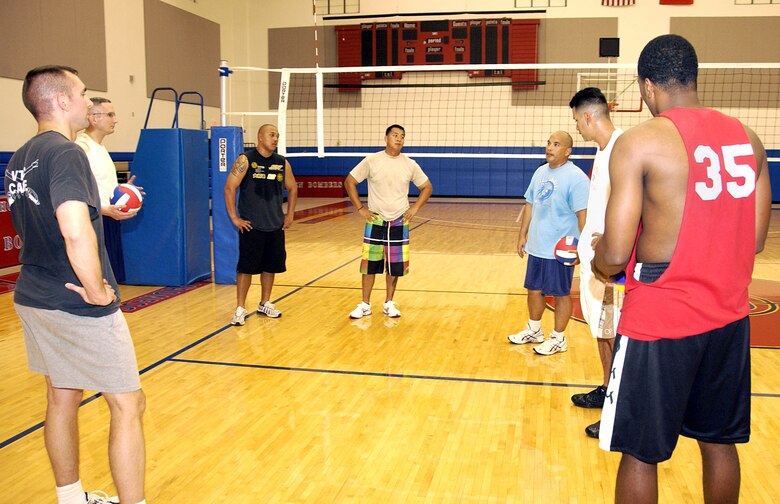 ANDERSEN AIR FORCE BASE, Guam -- After warming up, potential team members of Team Andersen's men's varsity volleyball team huddle up as future coach, Maj. Andrew Cruz, 36th Medical Operations Squadron, talks about the coming volleyball season April 7 at the Coral Reef Fitness Center Gym. (U.S. Air Force photo by Airman Carissa Wolff)                               