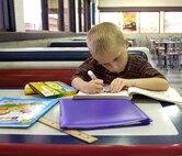 ANDERSEN AIR FORCE BASE, Guam -- Andersen Elementary School kindergarten student, Jarrett Mitchell concentrates as he colors a section in his coloring book April 8. Jarrett's teacher nominated him for star student due to his consideration for his peers, his conduct within the classroom and his academic progress through the school year. (U.S. Air Force photo by Airman Carissa Wolff)                                  