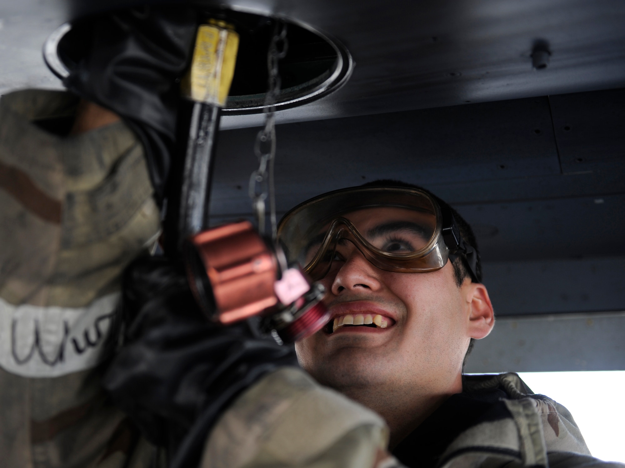 MOUNTAIN HOME AIR FORCE BASE, Idaho - Staff Sgt. Steven Cross, 389th Aircraft Maintenance Unit avionics, inserts a hydraulic line into an F-15 Eagle during the phase II Operational Readiness Exercise April 7. The exercise simulates Gunfighters are deployed to “Base X” for 30 days with hostilities for three days. The wing uses OREs to gauge its ability to meet war time taskings at a deployed location. The evaluation includes initial response, readiness, combat operations, ability to survive and operate, self aid and buddy care and mission support. (U.S. Air Force photo/ Senior Airman Stephany Miller)