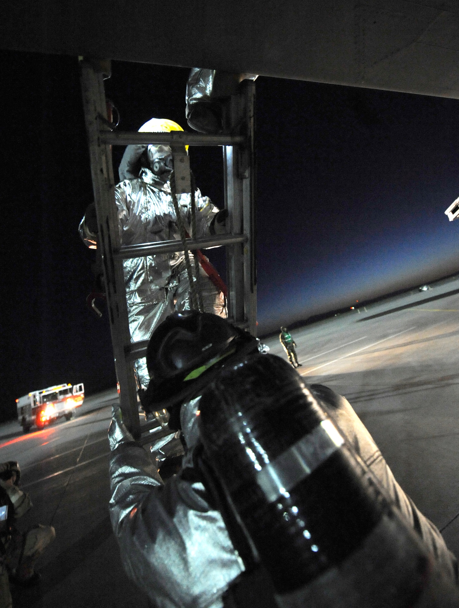 MOUNTAIN HOME AIR FORCE BASE, Idaho - Members of the 366th Civil Engineer Squadron fire prevention flight performs an aircrew extraction during the phase II Operational Readiness Exercise April 6. The exercise simulates Gunfighters are deployed to “Base X” for 30 days with hostilities for three days. The wing uses OREs to gauge its ability to meet war time taskings at a deployed location. The evaluation includes initial response, readiness, combat operations, ability to survive and operate, self aid and buddy care and mission support. (U.S. Air Force photo/ Senior Airman Stephany Miller)