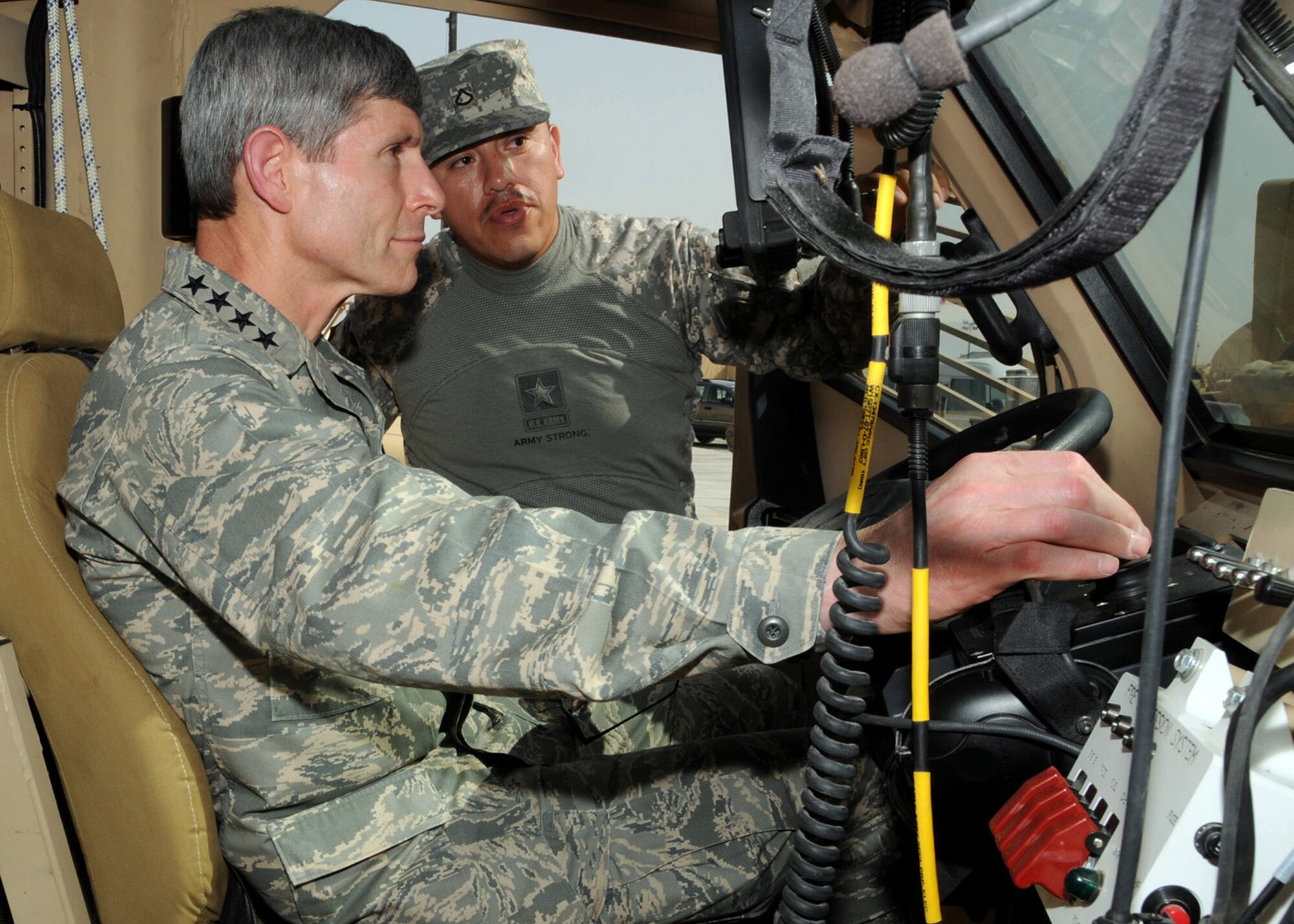 Air Force Chief of Staff Gen. Norton Schwartz receives a briefing at an Army base in Southwest Asia April 7 from an Army Soldier about the capabilities and benefits of the Mine Resistant Ambush Protected vehicle. During his visit, General Schwartz met with Airmen and Soldiers performing duties as line haul truckers in Iraq. (U.S. Air Force photo/Senior Airman Courtney Richardson) 
