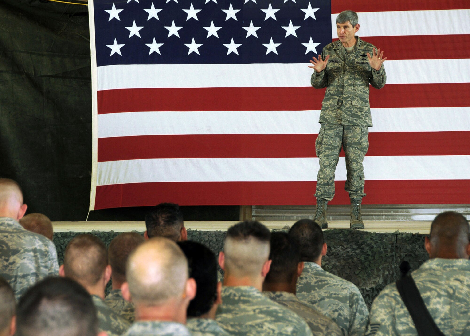 Air Force Chief of Staff Gen. Norton Schwartz informs Airmen of the 586th Air Expeditionary Group April 7 about the Air Force's role in the upcoming drawdown in Iraq and what lies ahead for Airmen in Afghanistan during an Airman's Call at an Army base in Southwest Asia. During his visit, General Schwartz was given a briefing on how the Airmen and Soldiers work together to complete the mission of combat trucking. (U.S. Air Force photo/Senior Airman Courtney Richardson)
