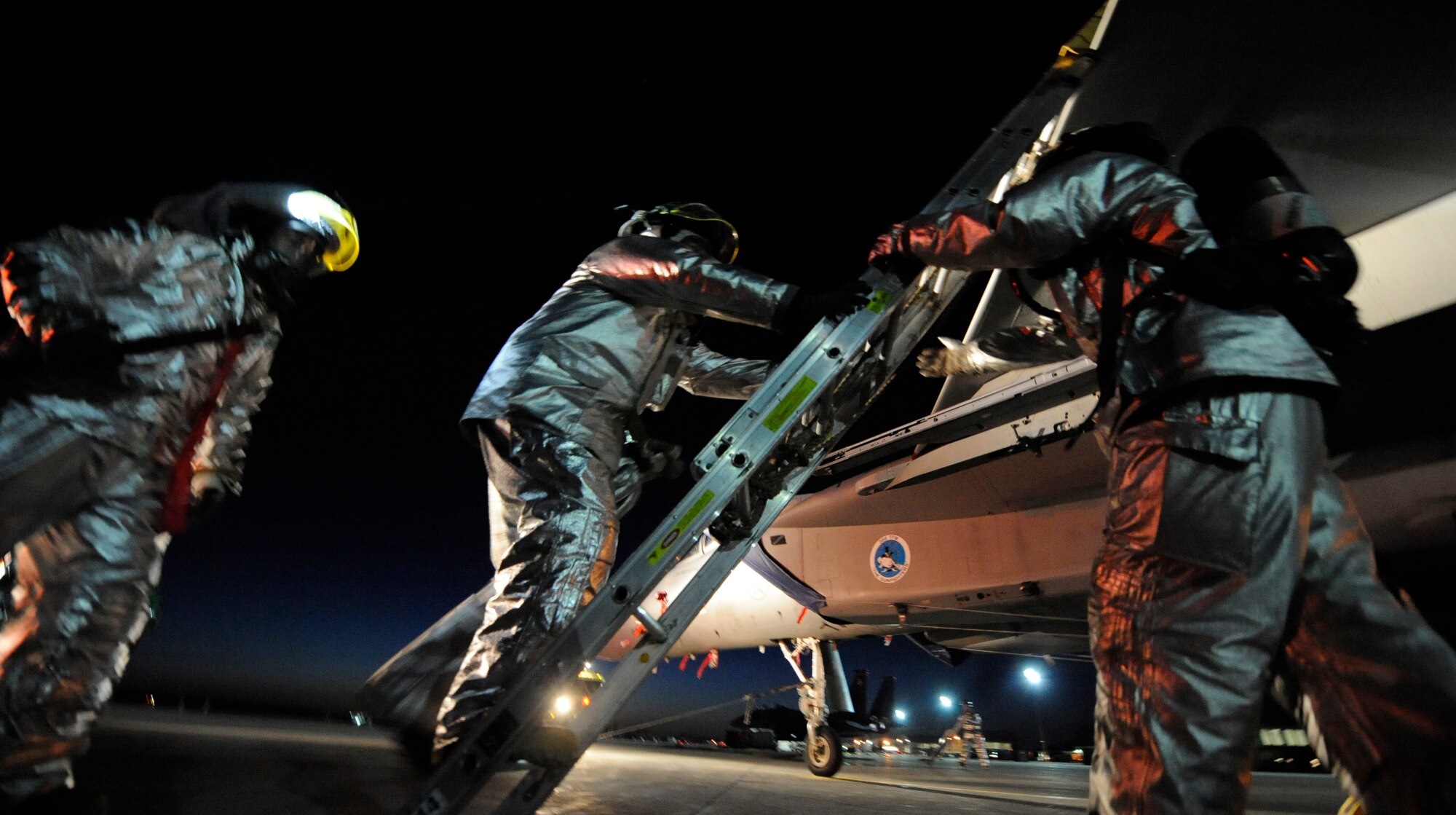 MOUNTAIN HOME AIR FORCE BASE, Idaho - Members of the 366th Civil Engineer Squadron fire prevention flight performs an aircrew extraction during the phase II Operational Readiness Exercise April 6. The exercise simulates Gunfighters are deployed to “Base X” for 30 days with hostilities for three days. The wing uses OREs to gauge its ability to meet war time taskings at a deployed location. The evaluation includes initial response, readiness, combat operations, ability to survive and operate, self aid and buddy care and mission support. (U.S. Air Force photo/ Senior Airman Stephany Miller)