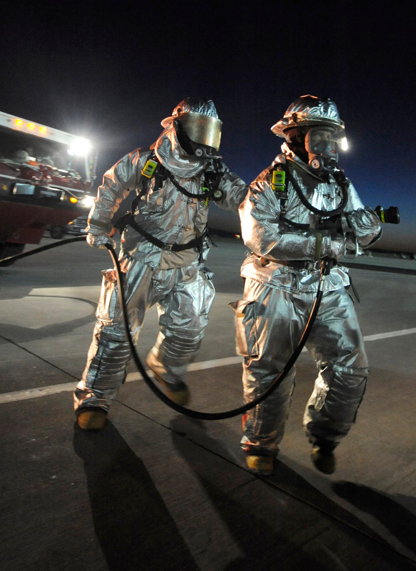 MOUNTAIN HOME AIR FORCE BASE, Idaho - Members of the 366th Civil Engineer Squadron fire prevention flight performs an aircrew extraction during the phase II Operational Readiness Exercise April 6. The exercise simulates Gunfighters are deployed to “Base X” for 30 days with hostilities for three days. The wing uses OREs to gauge its ability to meet war time taskings at a deployed location. The evaluation includes initial response, readiness, combat operations, ability to survive and operate, self aid and buddy care and mission support. (U.S. Air Force photo/ Senior Airman Stephany Miller)