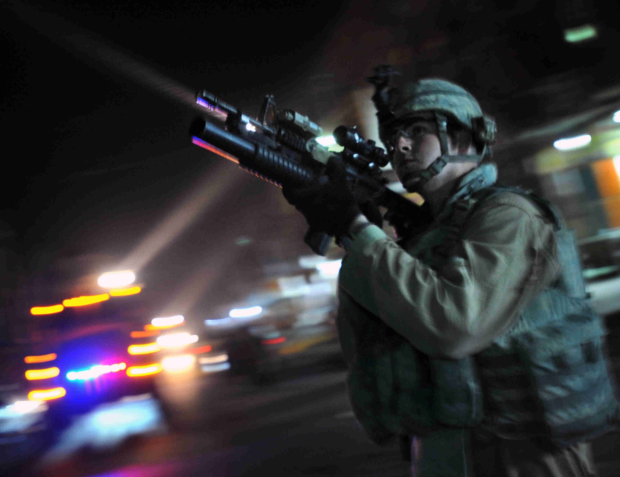 U.S. Air Force Sgt. Jarrett Cox of Lilburn Ga., scans his perimeter during a joint walking patrol with Iraqi National Policemen in the Sadiah district of southern Baghdad, Iraq, Dec. 17, 2008. (U.S. Navy Photo by Petty Officer 2nd Class Todd Frantom/Released)
