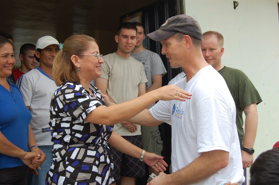 Ms. Asunción Barreto, a licensed social worker who runs the Urbirios community kitchen in Manta, Ecuador, thanks 478th Expeditionary Operations Squadron Commander, Lt. Col. Jared Curtis, after a day of painting March 21. Through the $7,000-worth of donated equipment from U.S. Southern Command’s Humanitarian Assistance Program (HAP), the kitchen may now open its doors to serve more members of the community better quality and portions of food. (U.S. Air Force photo by 1st Lt. Beth Woodward)