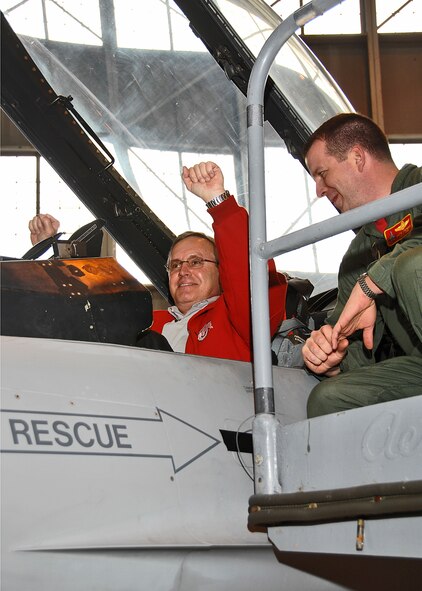 OSU's head football coach Jim Tressel sits in the cockpit of an F-16 Fighting Falcon during a Coaches Tour 2009 Kickoff Briefing at Wright-Patterson Air Force Base.  Coach Tressel visited the base to raise morale and show his support for the Air Force.  Coach Tressel will visit the U.S. Central Command's area of responsibility later this year with a handful of other collegiate coaches to visit the troops. (U.S. Air Force photograph/Ben Strasser)