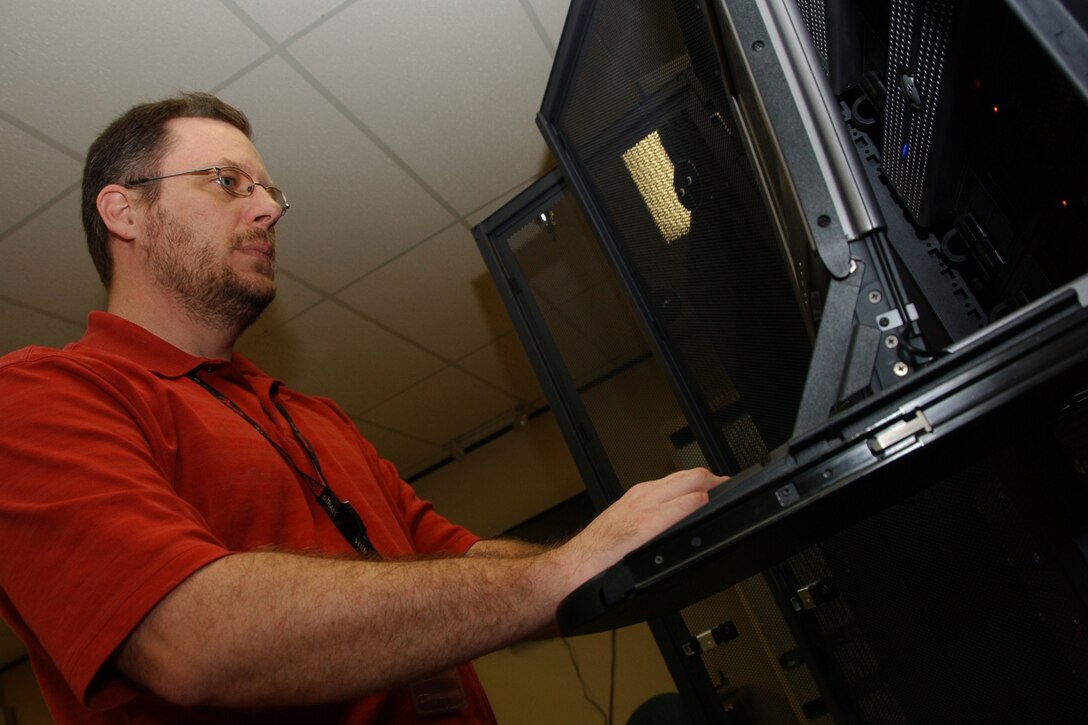 Dirk McCoy, a network control center senior system administrator for Computer Sciences Corporation, is responsible for system backups for Vance network drives. (U.S. Air Force photo by Staff Sgt. Brian Hill)                               