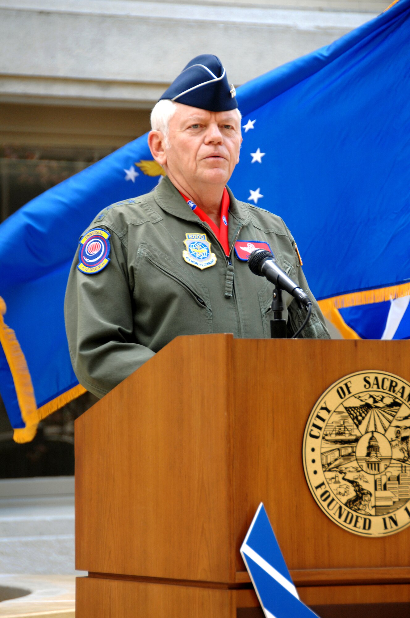 Gen. Arthur J. Lichte, Air Mobility Command commander, takes the podium during a joint press conference with Sacramento Mayor Kevin Johnson to officially announce Air Force Week Sacramento scheduled for Sept. 5 through 13. (U.S. Air Force photo/Amanda Lopez)