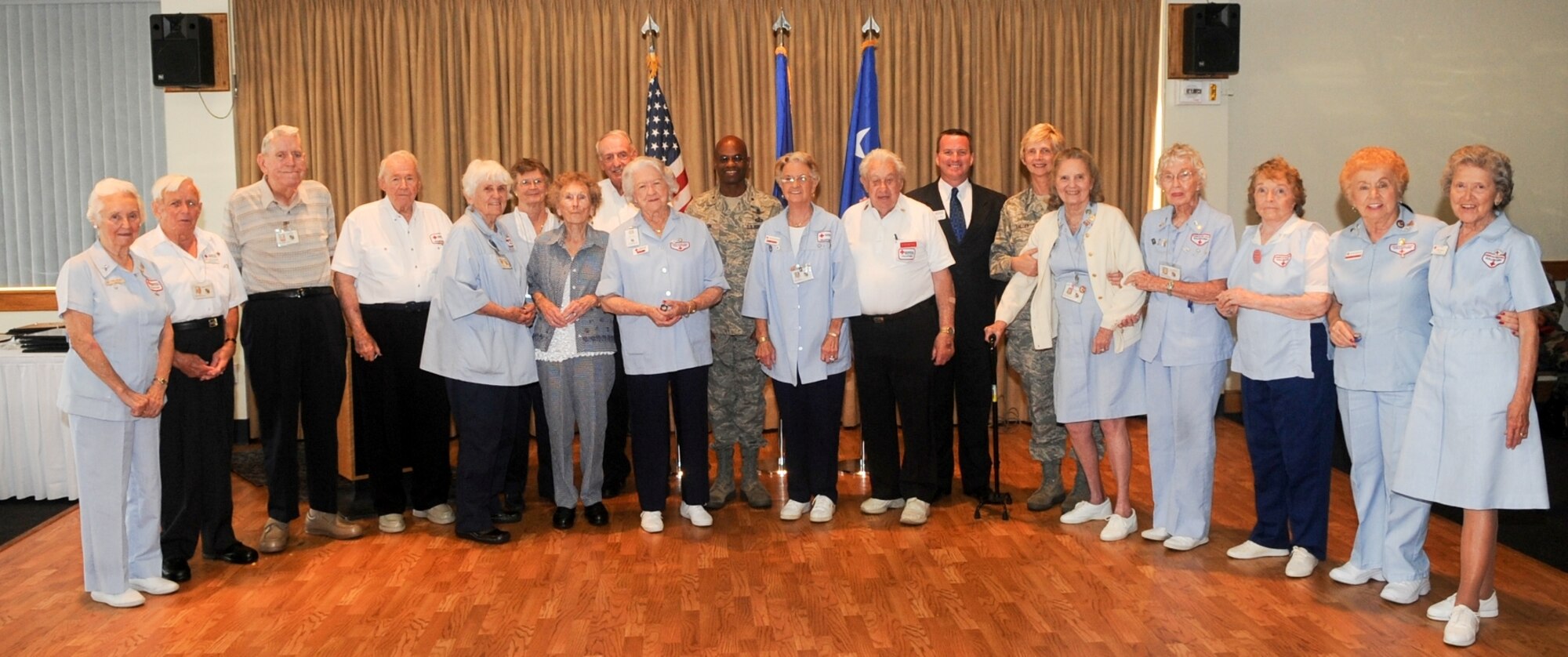 45th Space Wing Commander Brig. Gen. Edward L. Bolton Jr. (center), 45th Medical Group Commander Col. Florence Valley (sixth from right) and CEO of the Space Coast Chapter of the American Red Cross Keith Gee (in suit) congratulate the winners of the Presidential Award for Red Cross Volunteers at the annual Red Cross Luncheon April 2. Each of the winners has contributed more than 25 years and 5,000 hours of volunteer service.

“When I think of leaders, I list the 45th Space Wing volunteers among the best," said Colonel Valley. "Our volunteers exemplify the values upon which our country’s future depends – the quiet force President Obama spoke about during his inauguration. They give of themselves and the lives they touch are made richer for the experience.” (U.S. Air Force photo/John Connell)