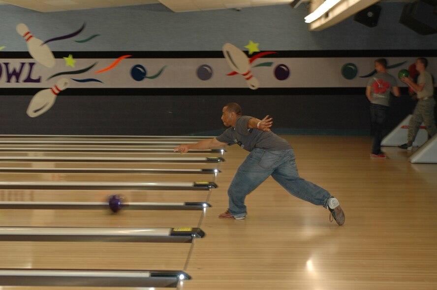 Willie Graham, Army Air Force Exchange Service employee, bowls during an Air Force Assistance Fund drive at the Travis Bowling Center, April 3. The event was held to help Travis reach its goal of $115,449. (U.S. Air Force photo/Tech. Sgt. Donald Osborn)

