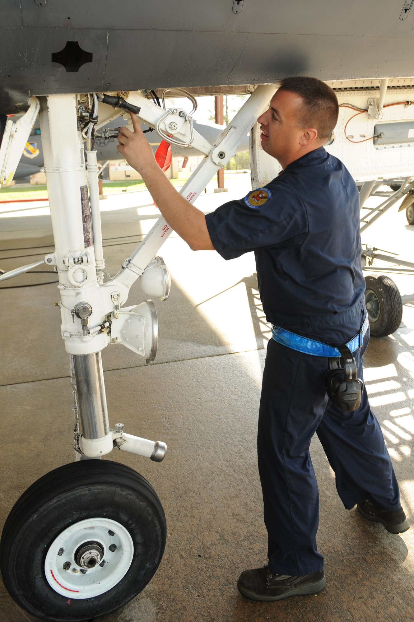 Staff Sgt. Shane Slaughter, 334th Aircraft Maintenance Unit, inspects an F-15E Strike Eagle after the aircraft was washed on Seymour Johnson Air Force Base, N.C., April 3, 2009. A post-wash inspection is part of a supervisor’s quality assurance check-list. (U.S. Air Force photo by Airman 1st Class Whitney S. Lambert)