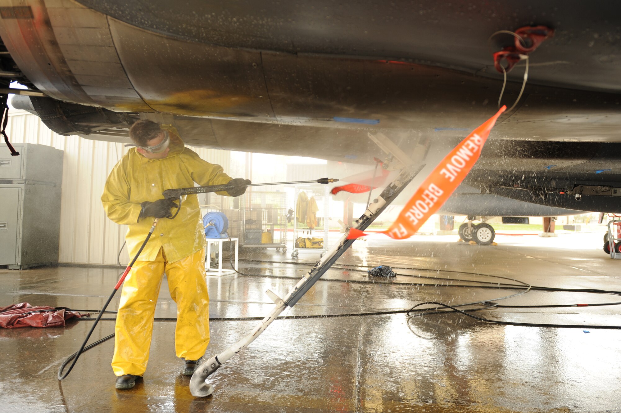 Staff Sgt. Douglas D’Agostino, 334th Aircraft Maintenance Unit, uses a pressure washer to clean the arresting hook on an F-15E Strike Eagle at Seymour Johnson Air Force Base, N.C., April 3, 2009. The aircraft are periodically cleaned by Airmen every 120 days to check for damages. (U.S. Air Force photo by Airman 1st Class Whitney S. Lambert)