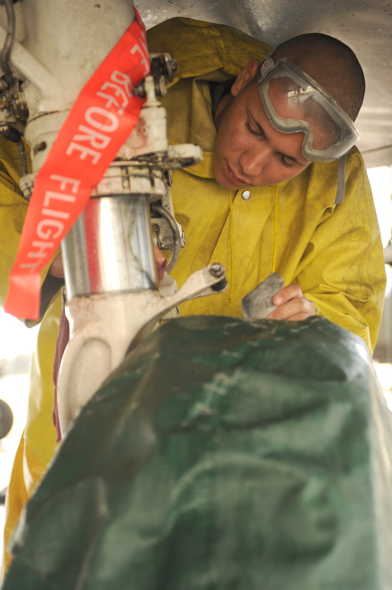 Airman 1st Class Anthony Ovechka, 334th Aircraft Maintenance Unit, wipes down a F-15E Strike Eagle tire at the wash rack at Seymour Johnson Air Force Base, N.C., April 3, 2009. Preventative tire maintenance minimizes repair and future problems on the F-15Es. (U.S. Air Force photo by Airman 1st Class Whitney S. Lambert)
