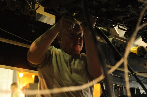 Staff Sgt. Douglas Rath, 4th Component Maintenance Squadron, tightens a feedback cable in the hush house at Seymour Johnson Air Force Base, N.C., April 6, 2009. A loose feedback cable can cause the engine to run hotter than normal or not perform at its peak. (U.S. Air Force photo by Airman 1st Class Whitney S. Lambert)