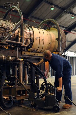 Staff Sgt. Robert Stewart, 4th Component Maintenance Squadron, fills an oil tank in the hush house at Seymour Johnson Air Force Base, N.C., April 6, 2009. Pumping the oil cart allows Sergeant Stewart to verify there is proper lubrication to run an engine test. (U.S. Air Force photo by Airman 1st Class Whitney S. Lambert)
