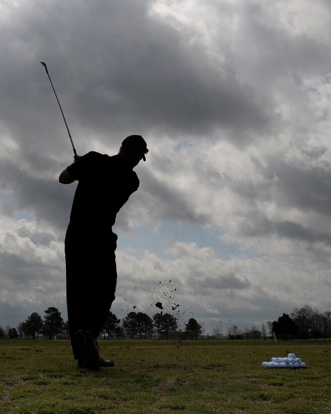 LANGLEY AIR FORCE BASE, Va. --  Brig. Gen. Mark A. Barrett, 1st Fighter Wing commander, warms up before his Golf Invitational Tournament here April 3.  More than 70 Airmen and civic leaders were invited by the commander to play in the 18 hole tournament.  (U.S. Air Force photo/Senior Airman Vernon Young)