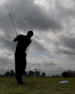 LANGLEY AIR FORCE BASE, Va. --  Brig. Gen. Mark A. Barrett, 1st Fighter Wing commander, warms up before his Golf Invitational Tournament here April 3.  More than 70 Airmen and civic leaders were invited by the commander to play in the 18 hole tournament.  (U.S. Air Force photo/Senior Airman Vernon Young)